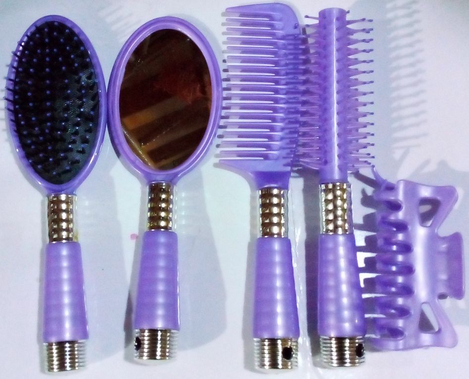 HAIR STYLING BRUSH, COMB, MIRROR AND HAIR PACKER