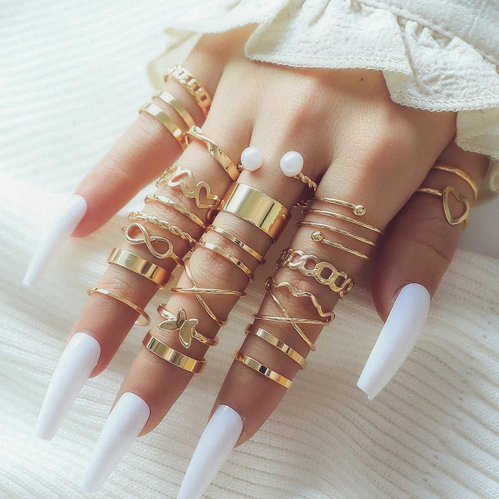 Girls ring new gold pearl heart butterfly cross hollow opening 23-piece set ring