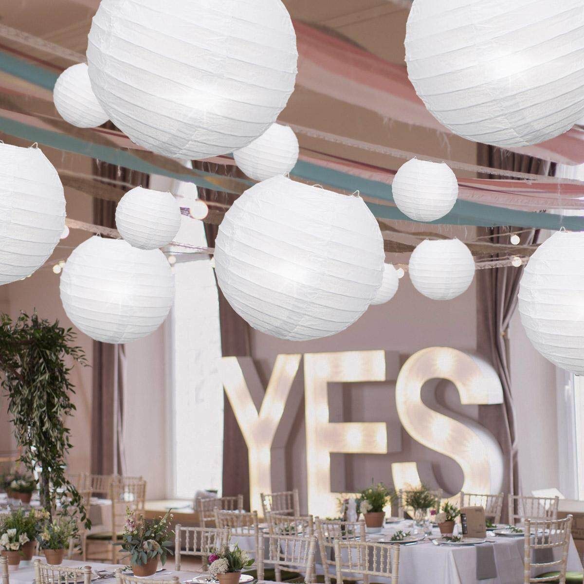 20 Packs Of White Paper Lanterns In A Circle With A Single Bag Containing 20 Sets Of Bags